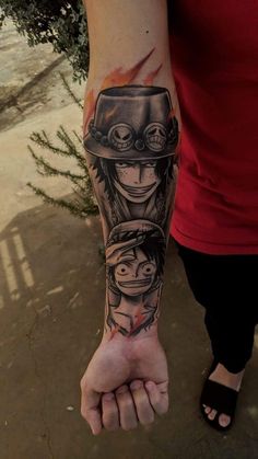 a person with a tattoo on their arm holding the hand of another person wearing a hat