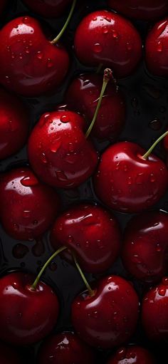 some cherries that are sitting in the water