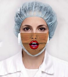 a woman wearing a surgical mask with the image of a female mouth painted on it