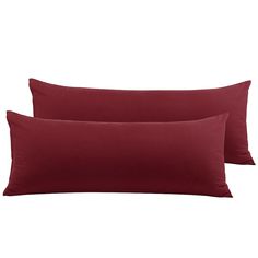 two red pillows sitting next to each other