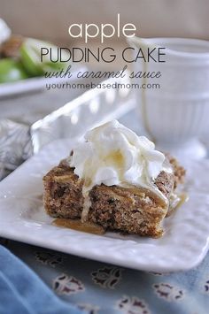 an apple pudding cake with caramel sauce and whipped cream on top is sitting on a white plate