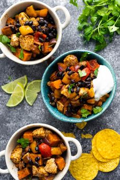 two bowls filled with mexican food next to tortilla chips