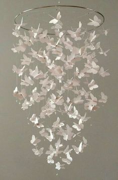 a mobile with butterflies hanging from it