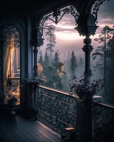 an ornate balcony overlooking the forest at night