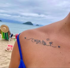 the back of a woman's shoulder with her name written in cursive writing