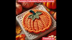 a crocheted pumpkin sitting on top of a table