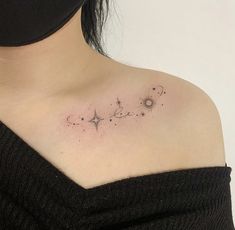 a woman's shoulder with stars and the word love tattooed on it