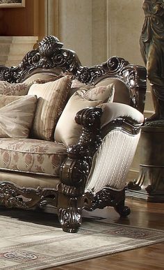 an ornately decorated couch sits in the middle of a room