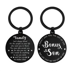 two black key chains with the words family and sons on them, one is for each other