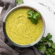 a bowl filled with broccoli and garnished with cilantro