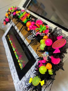 colorful decorations are on display in front of a mirror