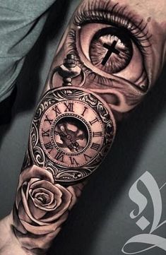 an eye and clock tattoo on the arm with roses in front of it is shown