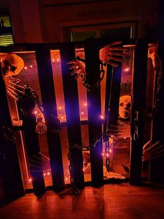 skeletons in a cage with lights around them