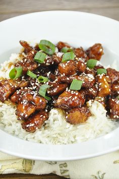 meatballs and rice on a plate with green onions