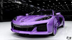 a purple sports car parked in a garage