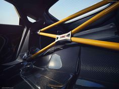 the inside of a car with yellow handles