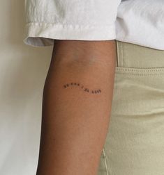 a person with a small tattoo on their arm