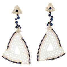 These stunning hand carved Jade earrings are thoughtfully and meticulously crafted in 18-karat gold. It is set in 32.10 carats Jade, 2.95 carats blue sapphire and .63 carats of sparkling diamonds. FOLLOW MEGHNA JEWELS storefront to view the latest collection & exclusive pieces. Meghna Jewels is proudly rated as a Top Seller on 1stDibs with 5 star customer reviews. All items manufactured by us are handmade and can be customized or redesigned. Composition Size-64X32 Total Weight-16.404 Gold Weight Carved Jade, Diamond Jewelry Designs, Jade Earrings, Blue Sapphire Diamond, Yellow Gold Jewelry, Gold Diamond Earrings, Jade Carving, Jade Jewelry, Antique Earrings