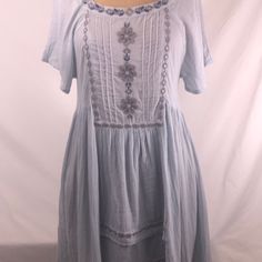 Stunning! This Is Such A Pretty Bluewater Navy, Gray And Silver Details. Square Neck In Front W Open Back High Low Hem. Comes Adjustable Cotton Slip. Two Side Pockets!!! I Bought This For Myself But Sadly Cannot Yet Wear A Small. Free People At Its Best Blue Short Sleeve Mini Dress For Spring, Light Blue Short Sleeve Mini Dress For Spring, Light Blue Bohemian Knee-length Dress, Light Blue Knee-length Bohemian Dress, Casual Light Blue Cotton Dress, Light Blue Cotton Sundress For Spring, Blue Flowy Breezy Dress, Flowy Blue Breezy Dress, Light Blue Casual Short Sleeve Dress