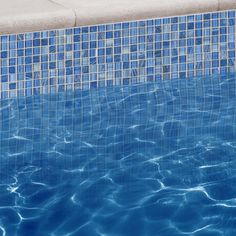 an empty swimming pool with clear blue water