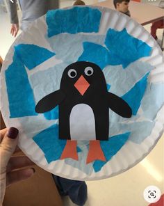 a paper plate with a penguin on it