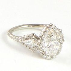 an engagement ring with two pear shaped diamonds