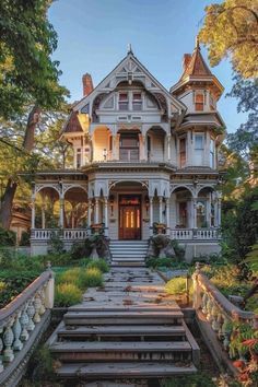 an old victorian house with steps leading up to the front door