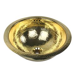 a round gold sink on a white background