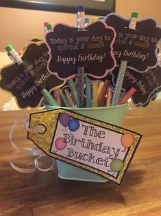 the birthday bucket is filled with markers and pencils