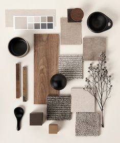 an assortment of different materials are arranged on a white surface with black and brown accents