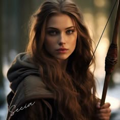 a beautiful young woman holding a bow and arrow