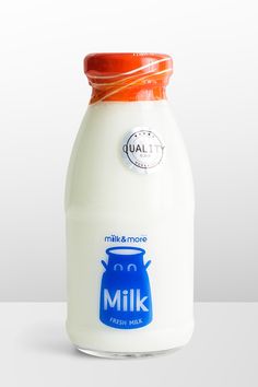 a bottle of milk with an orange cap