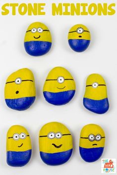 six yellow and blue painted rocks with faces