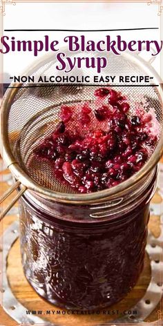 a jar filled with cranberry sauce on top of a wooden table