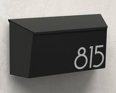 a black mailbox with the number 855 on it