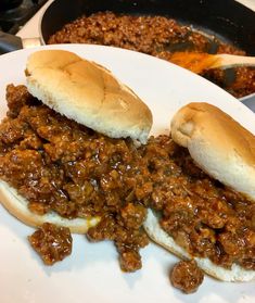 two sloppy joes are sitting on a plate