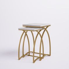 These nesting tables have a bright metallic finish and a retro silhouette to create an art deco aesthetic in your living room. They're built with a metal base in a sleek gold finish for a glam aesthetic. These tables feature dramatically curved legs that create an open, urn-shaped base. The genuine marble tabletops add to the luxe aesthetic. These tables measure 22" and 20.5" tall, so you can tuck them under one another to save on floor space. Etta Avenue™ | Etta Avenue™ Leonardo Modern End Tabl Gold Rectangle Side Table, Bronze Metal And Marble End Tables, Art Deco Aesthetic, Glam Aesthetic, Marble End Tables, Modern End Tables, Curtain Accessories, Floor Space, Nesting Tables