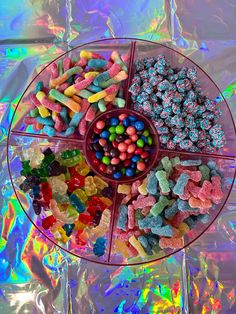 a plate filled with lots of different colored candies