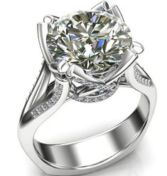 a white gold engagement ring with a large diamond center