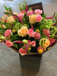 a bouquet of flowers sitting on top of a table