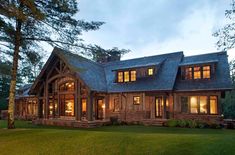 a large house lit up at night in the evening