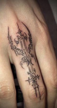 a woman's hand with a tattoo on it