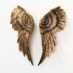 two metal wings on a white background