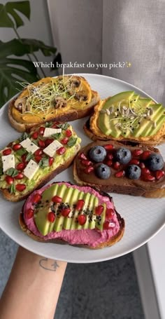 a person holding a plate with different types of food on it