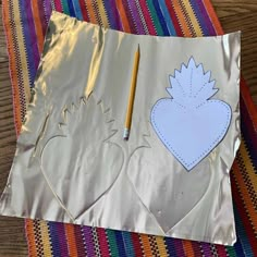 a piece of paper that has been cut out to look like a hedgehog with a heart on it