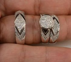 a person holding two rings with diamonds on them in their hand and the other one has an earring