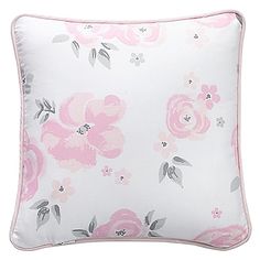 a white pillow with pink flowers on it