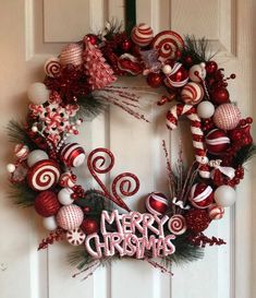 a christmas wreath with candy canes and ornaments