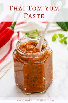 there is a jar filled with sauce and the words thai tom yum paste on it