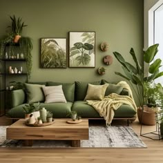 a living room with green walls and plants on the wall, including potted plants